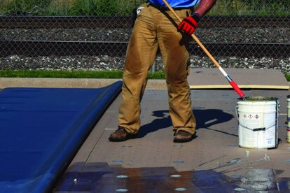 GAF Adhesive is rolled on both the substrate and membrane and allowed to flash off.