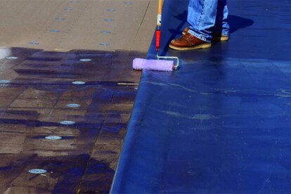GAF Worker applying Insulation to a deck